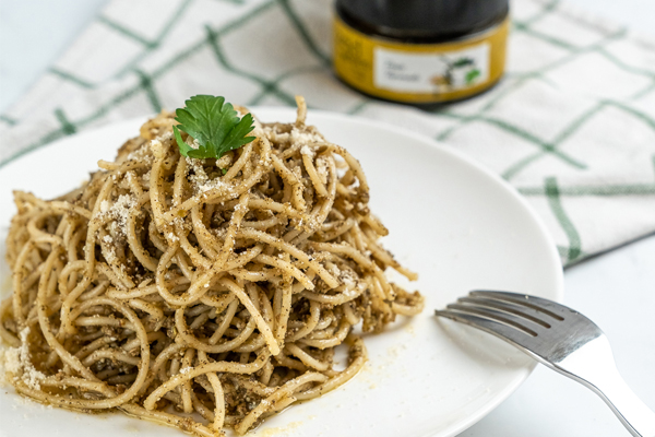 Pasta with pesto tapenade and parmesan cheese